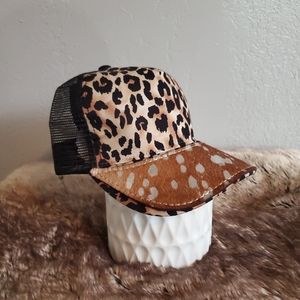 Ball cap with hand-sewn leather patch on brim